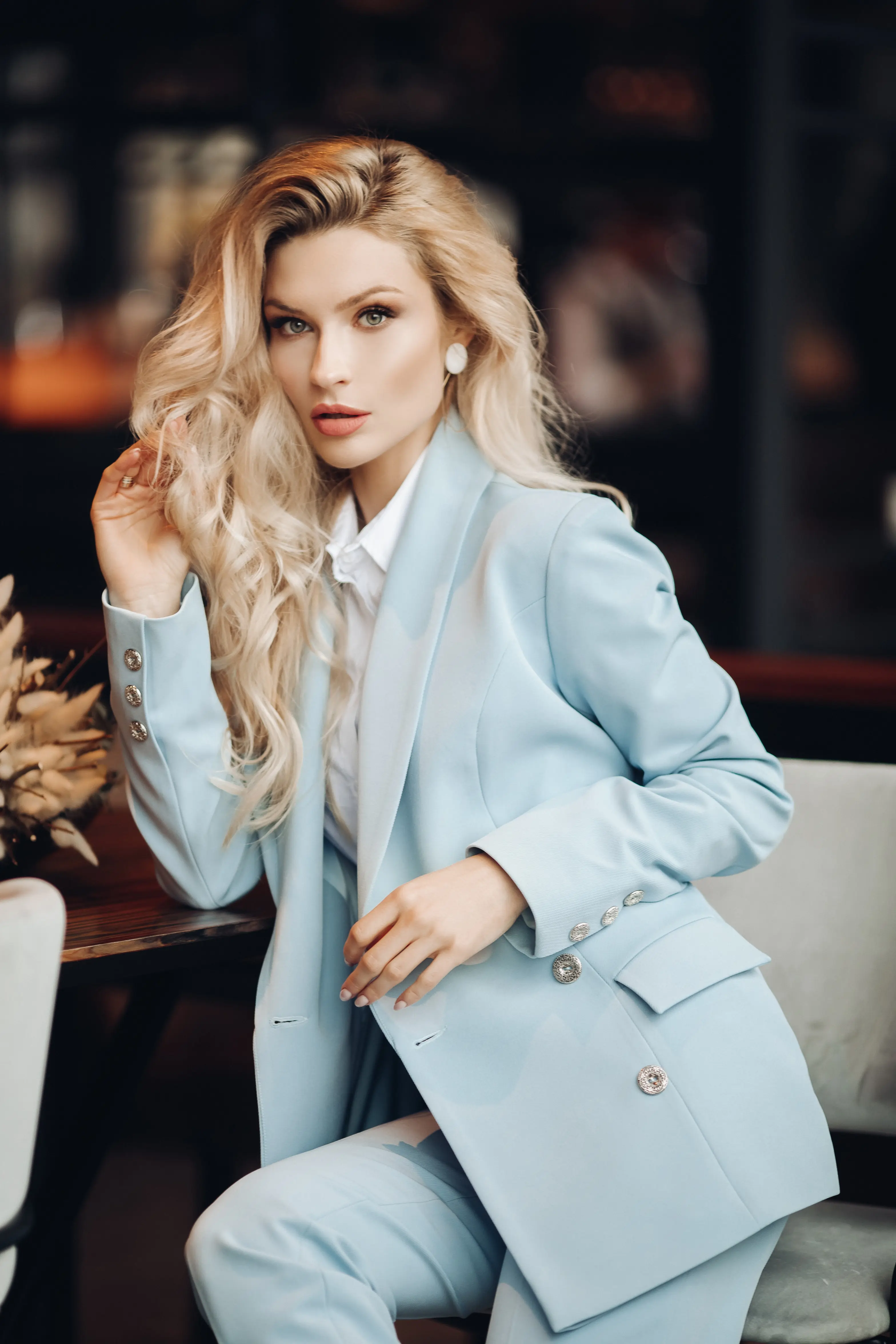 Blonde escort in blue suit
