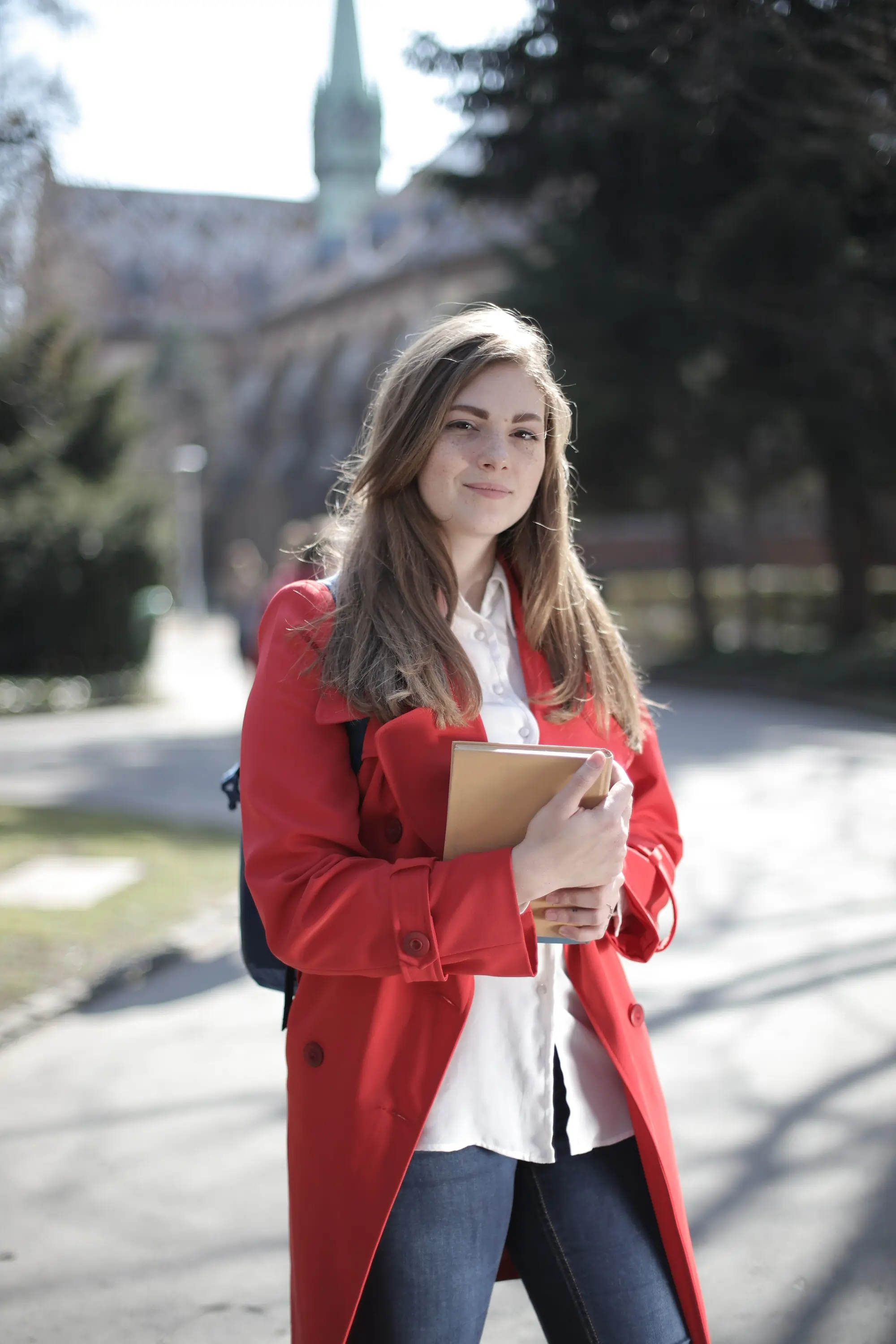 Brown-haired student escort with red jacket